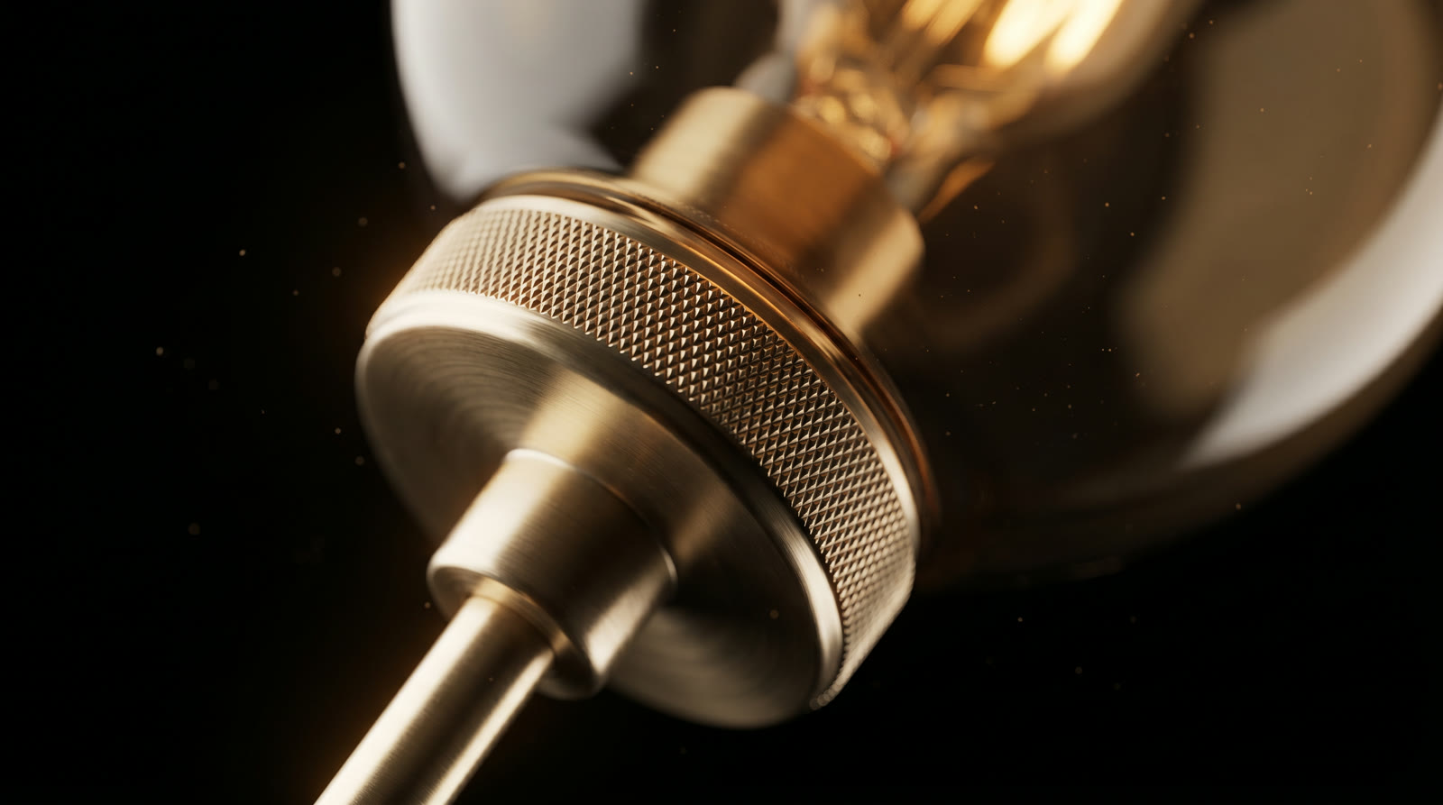 Extreme close-up of the knurled, hand-spun champagne-brass collar.